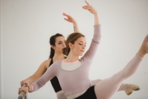 two-dancers-kick-high