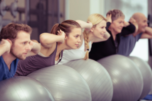 Group,Of,Diverse,People,In,A,Receding,Line,Doing,Pilates
