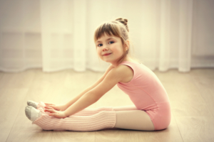 Little,Cute,Girl,In,Pink,Leotard,Making,New,Ballet,Movement